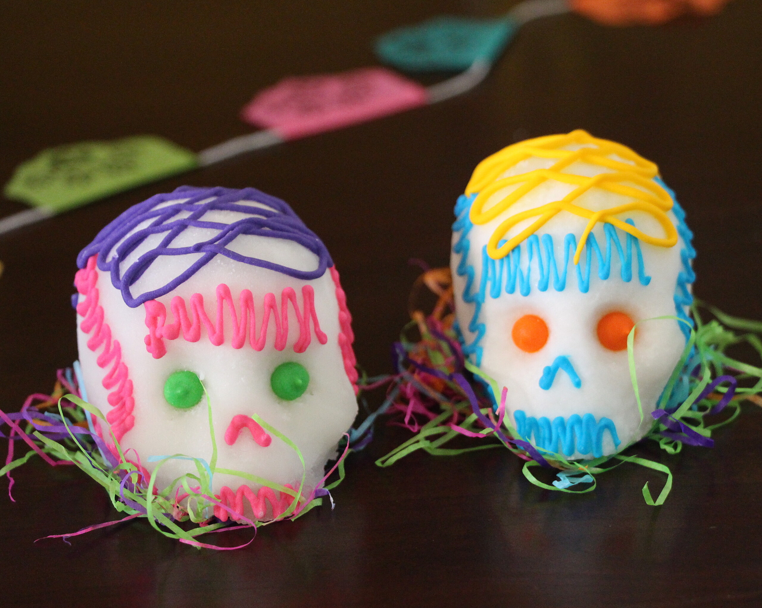 Calaveras or Sugar Skulls: These friendly faces symbolize the spirits being honored and their individual personalities. They can be made out of sugar, chocolate, paper mâché, wood, or any other material. In pre-Columbian times, Aztecs used amaranth seeds instead of sugar to make the skulls. Edible skulls are often consumed by kids after the celebration and are an example of a Mexican’s ability to celebrate, mock and play with death. 